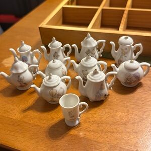1992 Precious Moments “friendship” miniature teapots. 21 pieces
